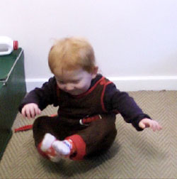 Infant scooting on bottom (bottom shuffling)