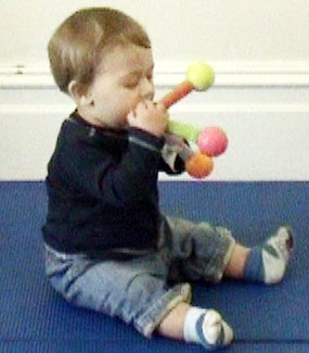 W 8m mouthing a toy_1.jpg