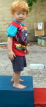 T 2y 1m standing on block_1.jpg